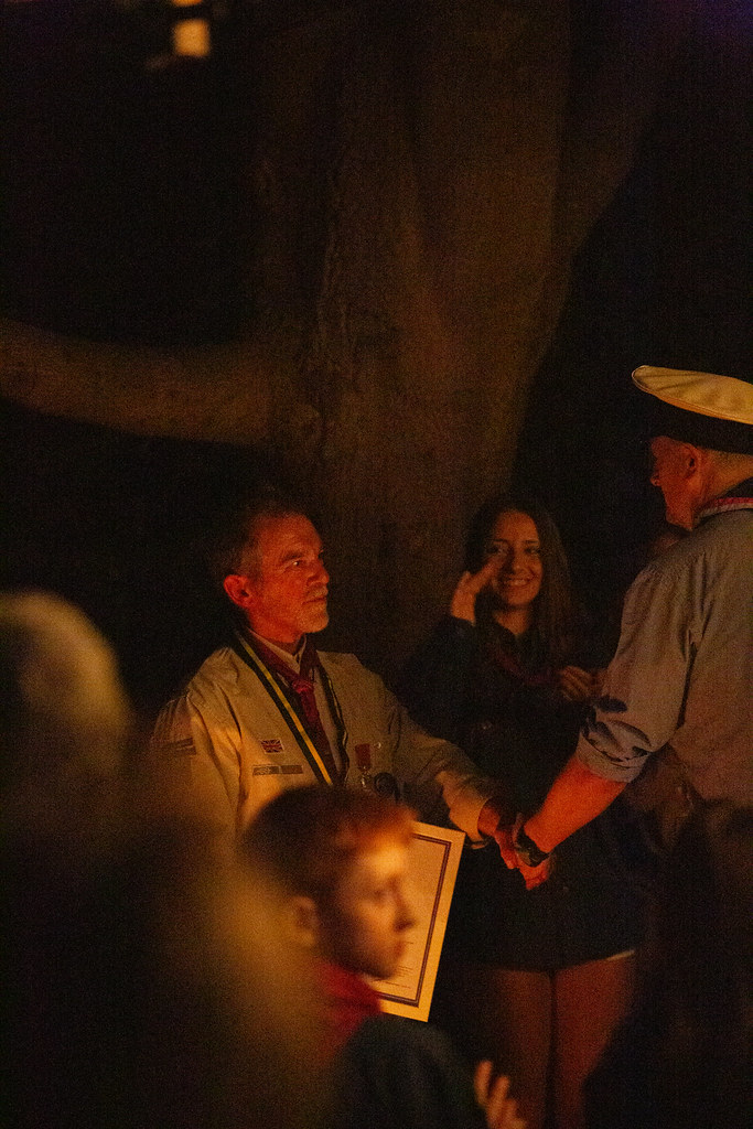 Keith and the County Lead Volunteer shaking hands after having his award presented. The County Lead is wearing a Sea Scout Blue Shirt and hat.